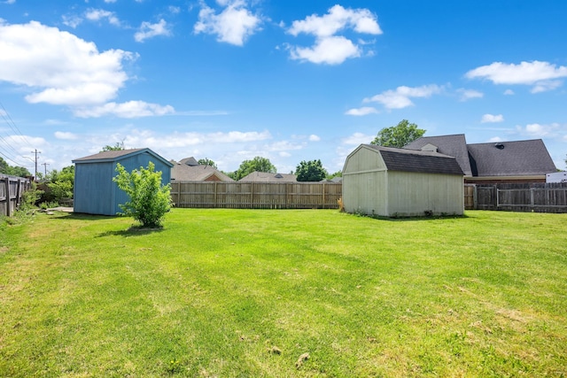 6747 Wild Ln, Bartlett, TN 38135 - view of yard featuring a fenced backyard, an outdoor structure, and a shed