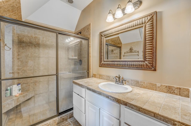 bathroom with vanity and a stall shower