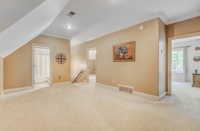 bonus room with visible vents, baseboards, and light carpet
