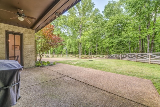 view of patio featuring ceiling fan, a fenced backyard, and a grill