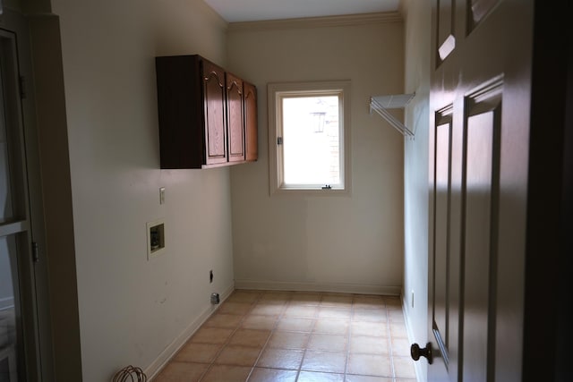 washroom featuring electric dryer hookup, cabinet space, baseboards, hookup for a washing machine, and ornamental molding