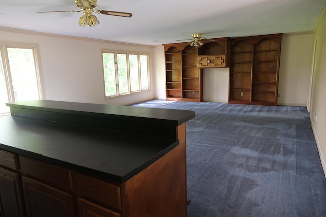 living area featuring a ceiling fan, ornamental molding, and dark colored carpet