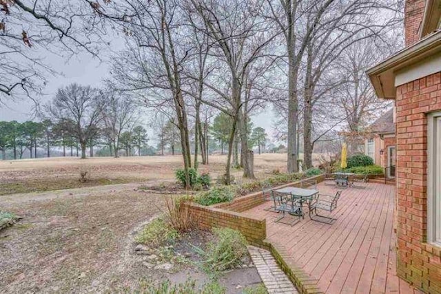 deck featuring outdoor dining area