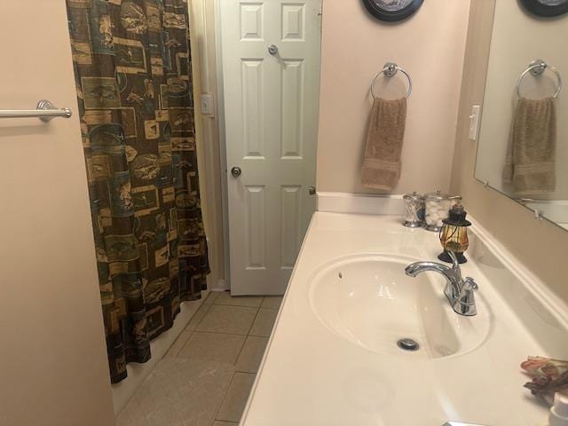 full bath with vanity, tile patterned floors, and curtained shower