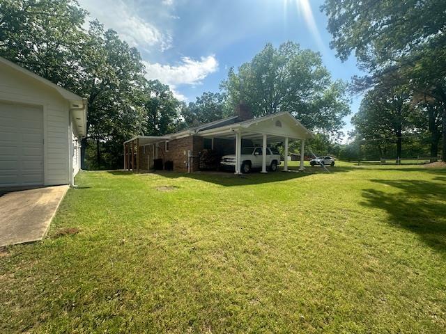 view of yard featuring a carport