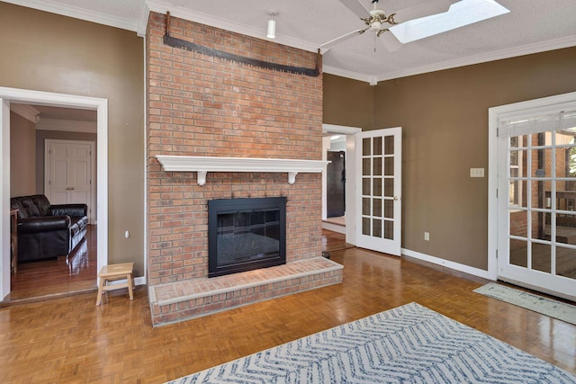 3365 Stone Creek Cv, Collierville, TN 38017 - unfurnished living room featuring baseboards, ornamental molding, a fireplace, and a ceiling fan