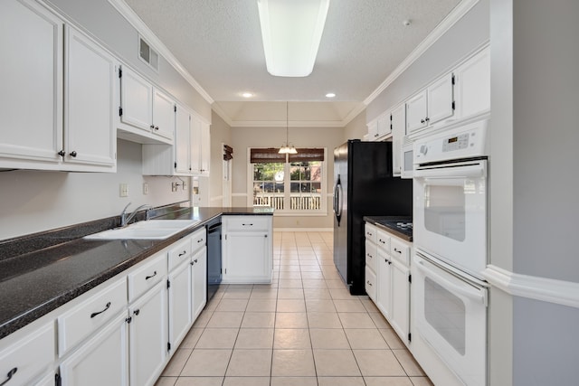 3365 Stone Creek Cv, Collierville, TN 38017 - kitchen with a sink, light tile patterned floors, white cabinets, and black appliances