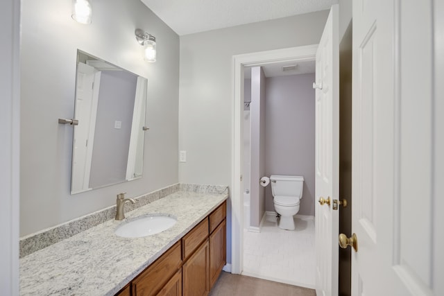 3365 Stone Creek Cv, Collierville, TN 38017 - bathroom with toilet, tile patterned flooring, and vanity