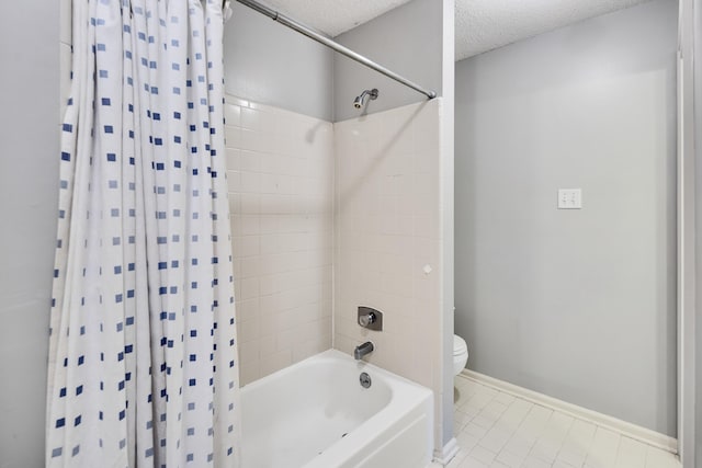 3365 Stone Creek Cv, Collierville, TN 38017 - bathroom featuring a textured ceiling, tile patterned floors, baseboards, toilet, and shower / bathtub combination with curtain