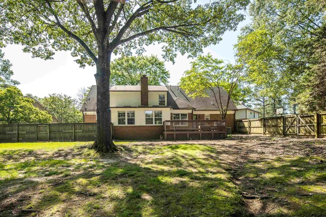 3365 Stone Creek Cv, Collierville, TN 38017 - rear view of property with a chimney, a fenced backyard, a lawn, and a deck