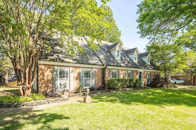 3365 Stone Creek Cv, Collierville, TN 38017 - cape cod house featuring a front yard and brick siding