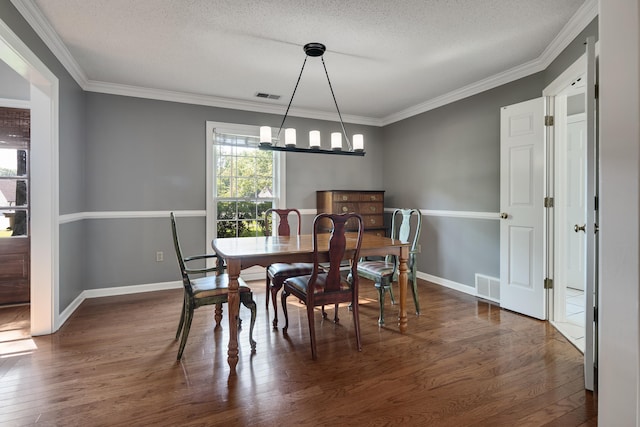 3365 Stone Creek Cv, Collierville, TN 38017 - dining space with crown molding, visible vents, wood finished floors, and a notable chandelier