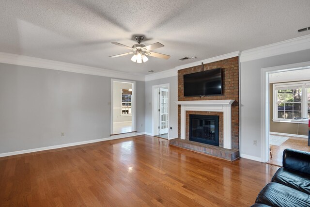 3365 Stone Creek Cv, Collierville, TN 38017 - unfurnished living room with a ceiling fan, a textured ceiling, ornamental molding, and baseboards