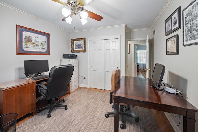 office area featuring crown molding, ceiling fan, visible vents, and light wood-style floors