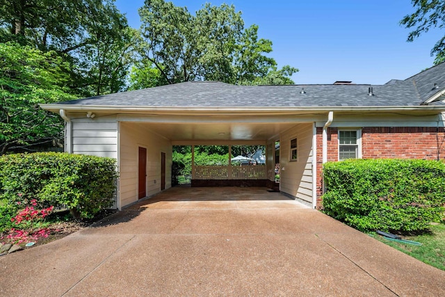 view of car parking with driveway and an attached carport