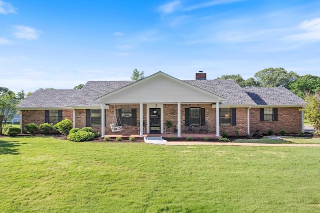 90 Shaker Dr, Senatobia, MS 38668 - ranch-style home featuring a chimney, a porch, a front lawn, and brick siding
