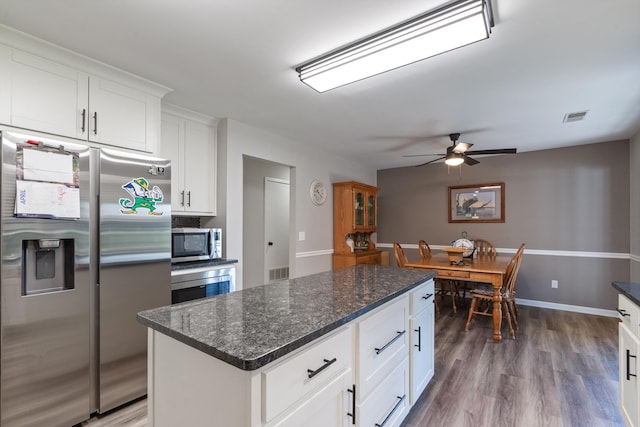 90 Shaker Dr, Senatobia, MS 38668 - kitchen with ceiling fan, appliances with stainless steel finishes, wood finished floors, and visible vents