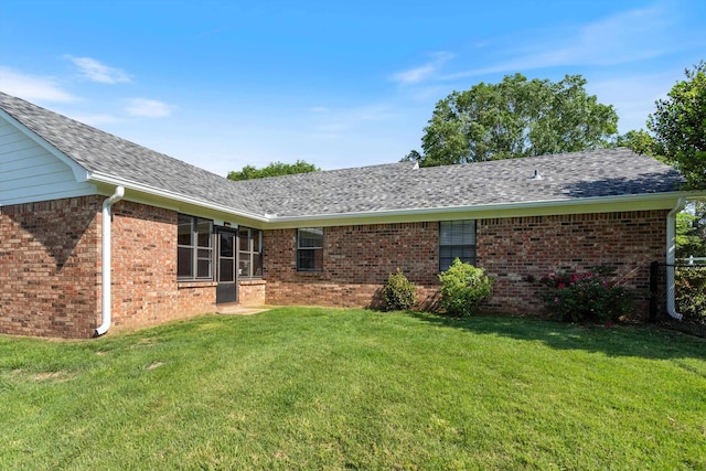 90 Shaker Dr, Senatobia, MS 38668 - back of property with brick siding, roof with shingles, and a yard