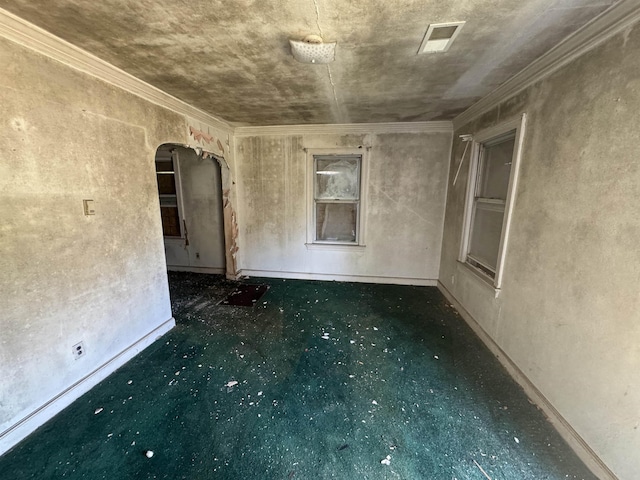 unfurnished room featuring arched walkways