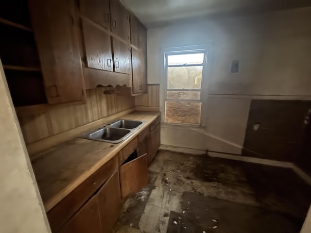 kitchen featuring light countertops and a sink