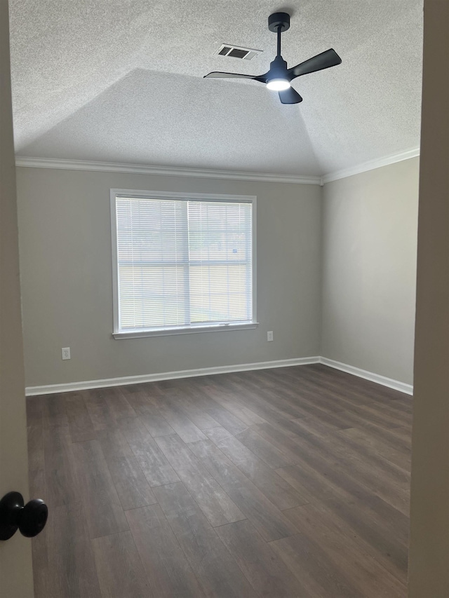empty room featuring visible vents, a ceiling fan, a textured ceiling, and dark wood-style floors