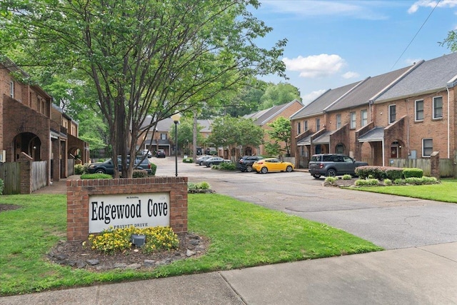 exterior space featuring street lights and a residential view