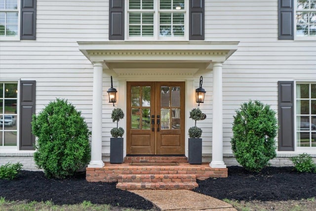 doorway to property with french doors and covered porch