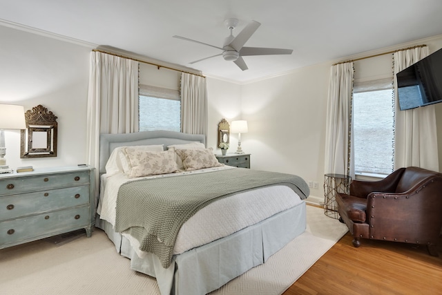 246 Palisade St, Memphis, TN 38111 - bedroom with light wood-style floors, multiple windows, ornamental molding, and a ceiling fan