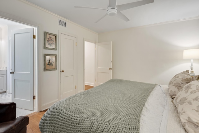 246 Palisade St, Memphis, TN 38111 - bedroom with crown molding, a ceiling fan, visible vents, and light wood finished floors