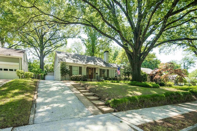 246 Palisade St, Memphis, TN 38111 - ranch-style home with a garage, a chimney, driveway, and a front lawn