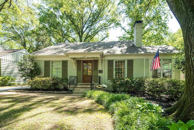 246 Palisade St, Memphis, TN 38111 - ranch-style home with brick siding, a chimney, and a front lawn
