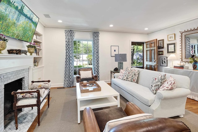 246 Palisade St, Memphis, TN 38111 - living area featuring a healthy amount of sunlight, a fireplace, recessed lighting, and wood finished floors