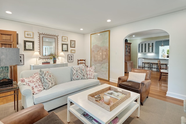 246 Palisade St, Memphis, TN 38111 - living area featuring crown molding, arched walkways, recessed lighting, and wood finished floors