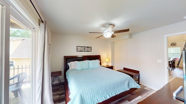 bedroom with baseboards, ceiling fan, and wood finished floors