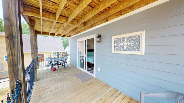 wooden deck featuring outdoor dining area