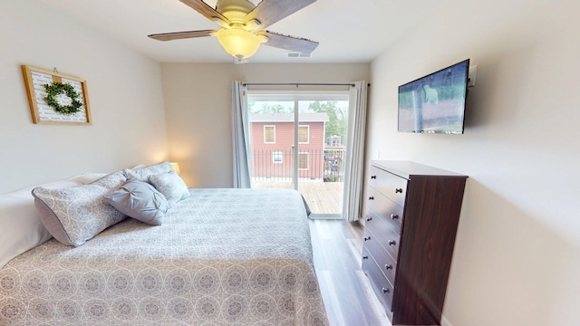 bedroom featuring visible vents, light wood-style floors, ceiling fan, and access to outside