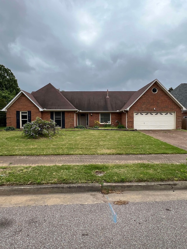 single story home with a front yard, a garage, brick siding, aphalt driveway, and a shingled roof