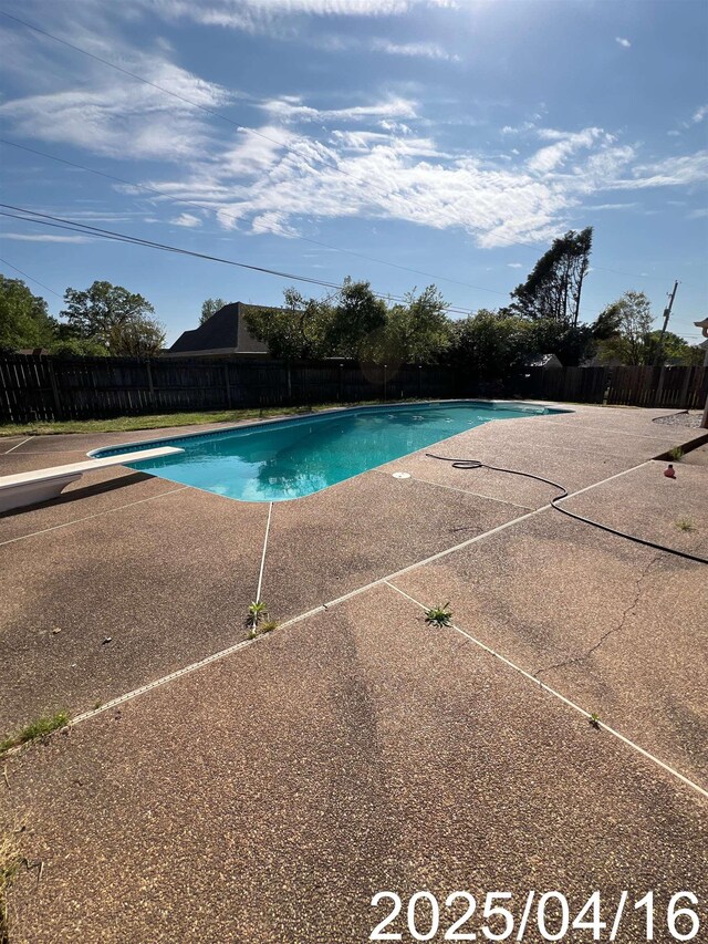 view of swimming pool featuring a patio, a fenced in pool, and a fenced backyard