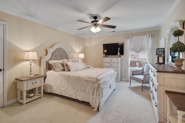 bedroom featuring crown molding, ceiling fan, visible vents, and light carpet