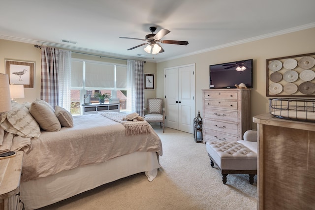 bedroom featuring ornamental molding, light carpet, ceiling fan, and visible vents