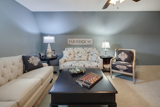 carpeted living area with ceiling fan