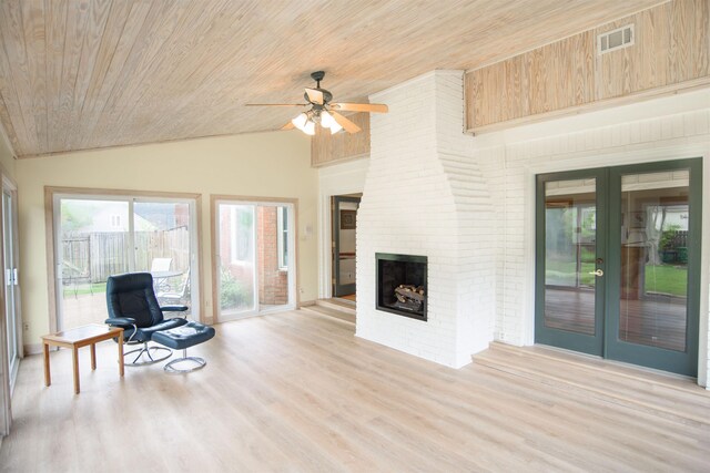 living area with french doors, light wood-style flooring, a ceiling fan, vaulted ceiling, and wood ceiling
