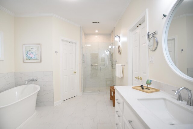 full bath with vanity, marble finish floor, a freestanding tub, recessed lighting, and a stall shower