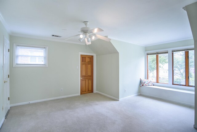 additional living space featuring visible vents, carpet flooring, ceiling fan, and a wealth of natural light