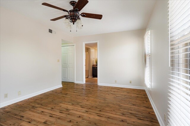 1186 Chamberlain Dr Unit 4, Memphis, TN 38119 - unfurnished room with a ceiling fan, baseboards, visible vents, and wood finished floors