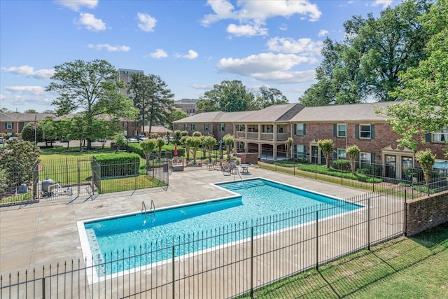 pool featuring a patio and fence