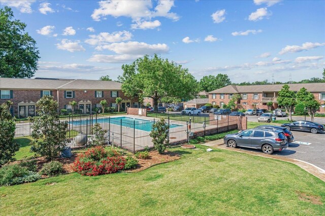 1186 Chamberlain Dr Unit 4, Memphis, TN 38119 - pool featuring a yard, fence, and a residential view