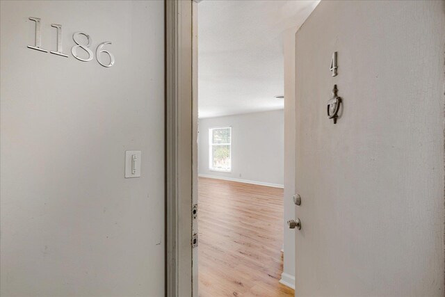 1186 Chamberlain Dr Unit 4, Memphis, TN 38119 - hallway featuring baseboards and light wood-style flooring