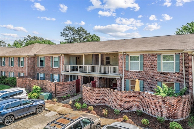 1186 Chamberlain Dr Unit 4, Memphis, TN 38119 - view of building exterior featuring uncovered parking
