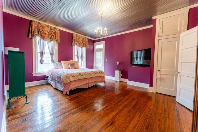 171 White St, Savannah, TN 38372 - bedroom featuring ornamental molding, a notable chandelier, multiple windows, and hardwood / wood-style floors